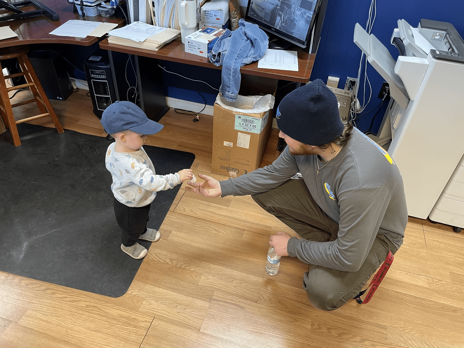 Goldkamp employee interacting with a young fan in Lake St. Louis